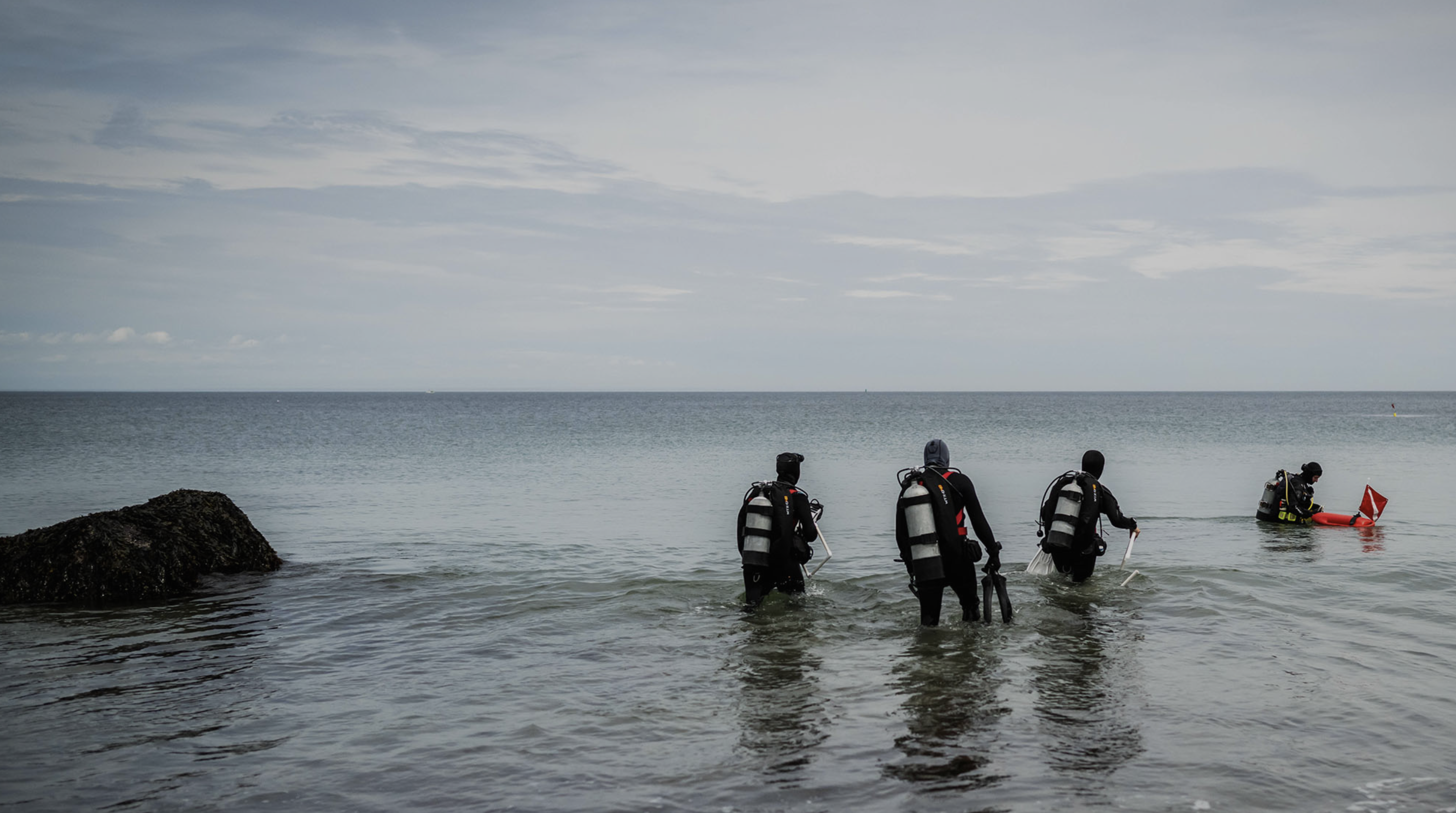 Scuba divers going into the water